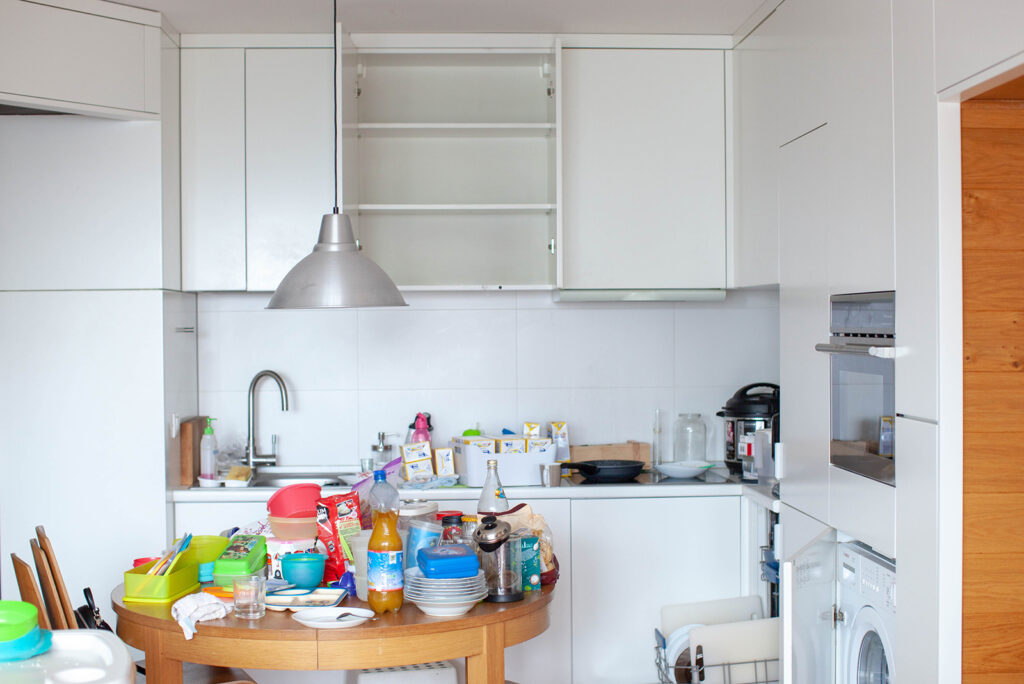 decluttering kitchen tools and other kitchen items, all gathered on the table