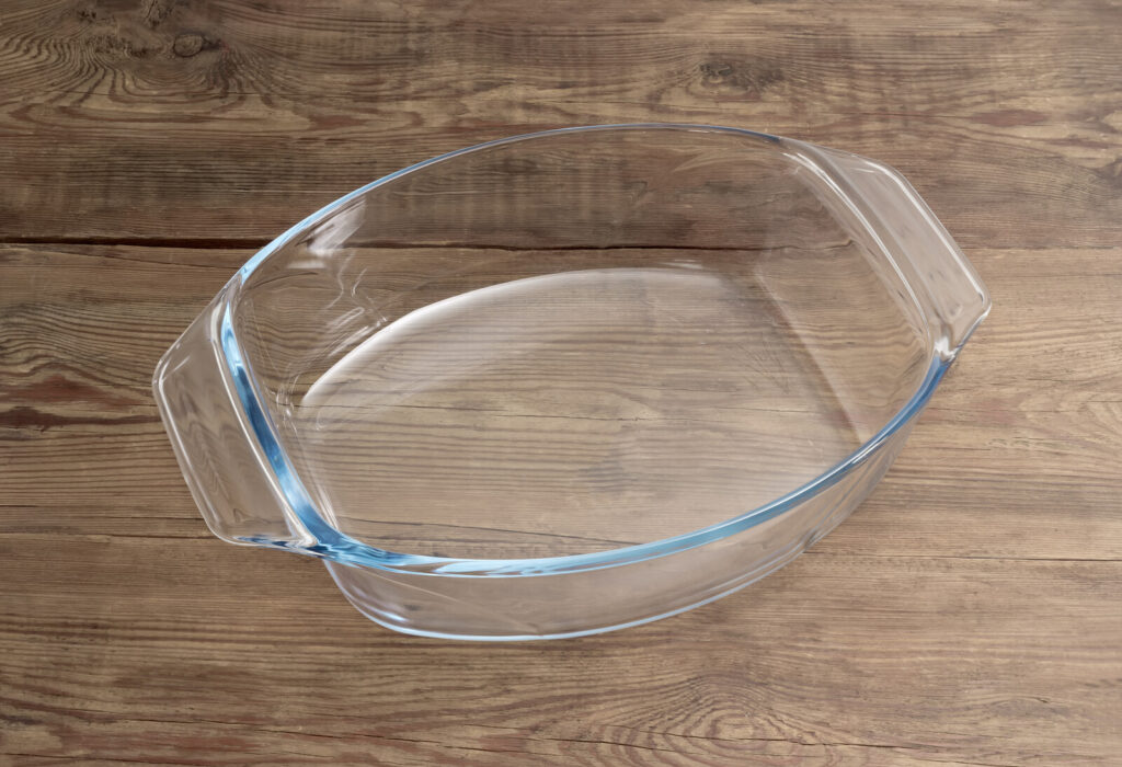 a glass baking dish on a wooden surface