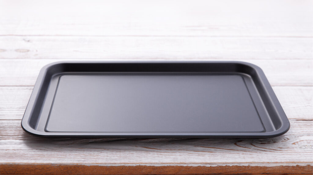 close up image of a metal baking sheet on a wooden table