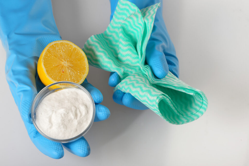 baking soda, lemon, and kitchen towel, how to clean your stove top