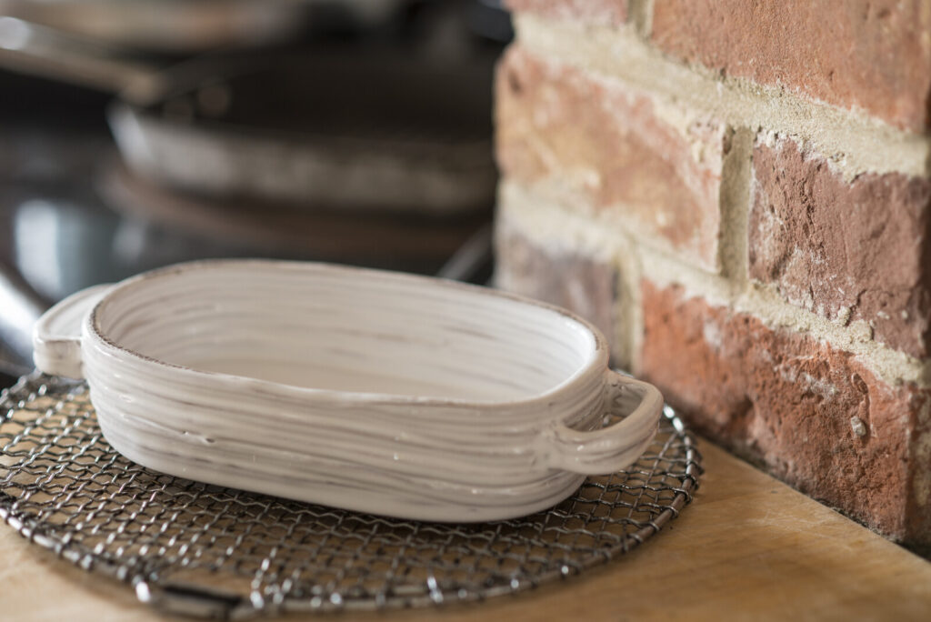 an oven dish on a metal trivet