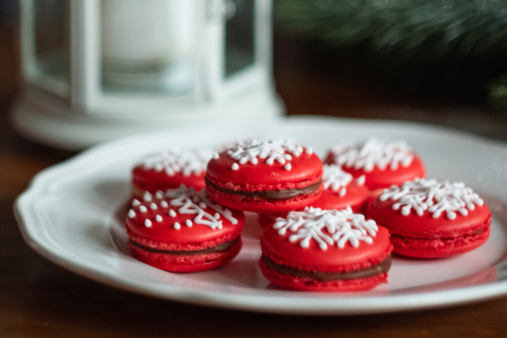 bright red Christmas cookies on a white plate, representing the article "Christmas Dinner Tips" by My Kitchendom