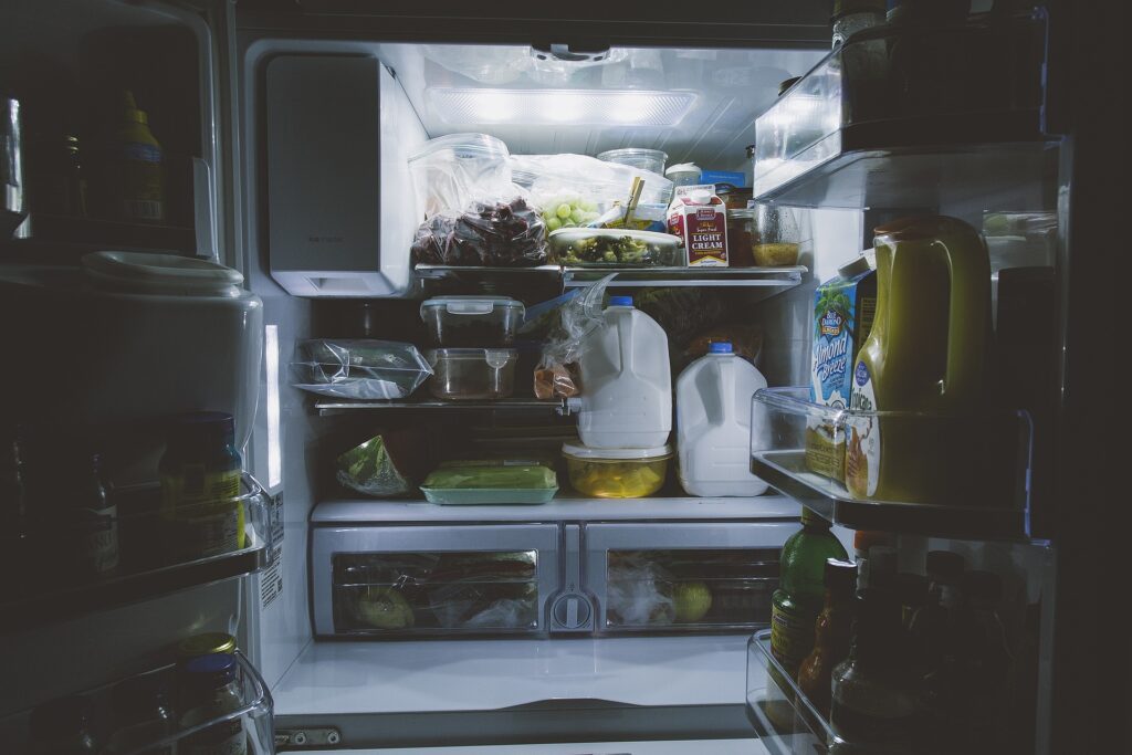 an open packed refrigerator, representing the article "MarieKondo-ing Your Fridge: How To Organize Your Refrigerator" by My Kitchendom