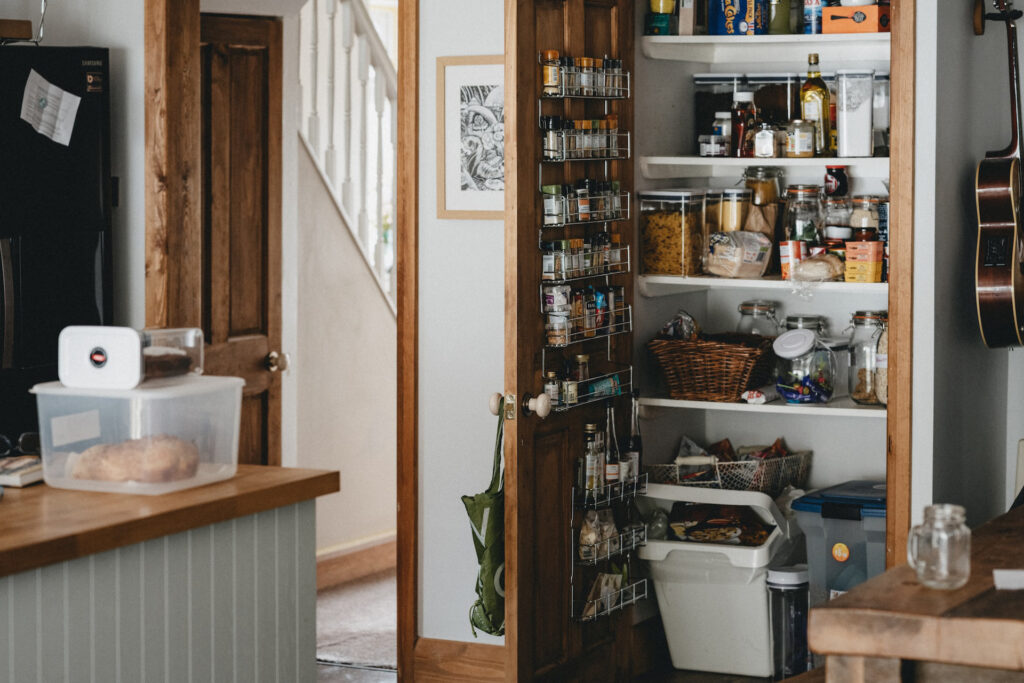 an open pantry representing the article "New Year, New Kitchen: The Best Way To Organize Kitchen" by My Kitchendom