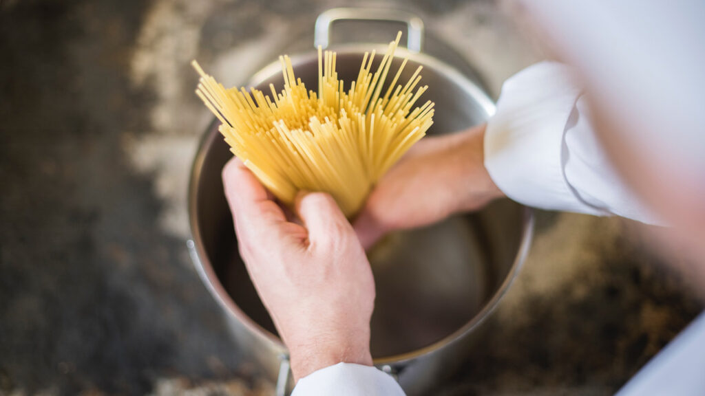 adding pasta in boiling water