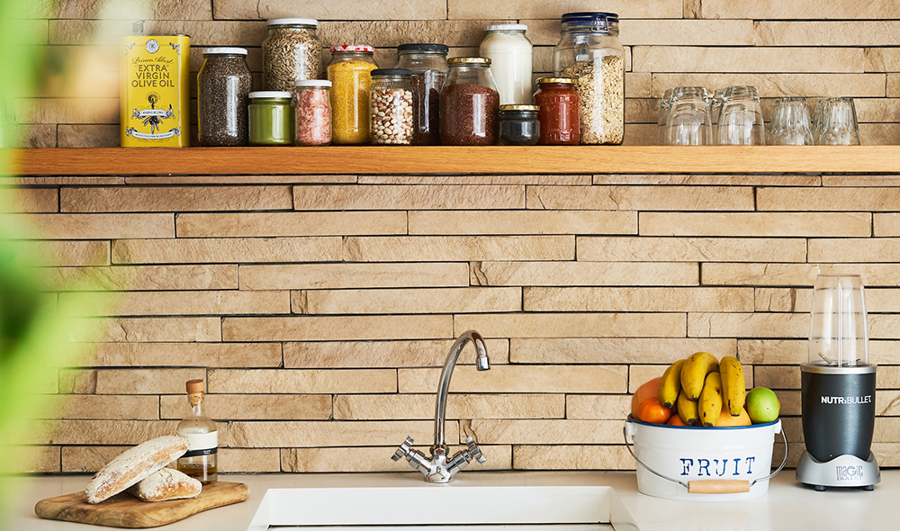 a floating shelf above the kitchen sink, representing the article "No Pantry, No Problem: How To Organize a Small Kitchen Without a Pantry" by My Kitchendom